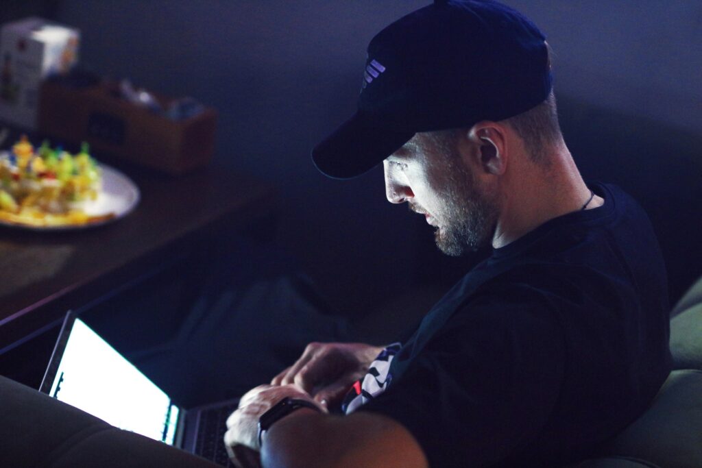 man with a laptop - Futures Prop Trading Firms