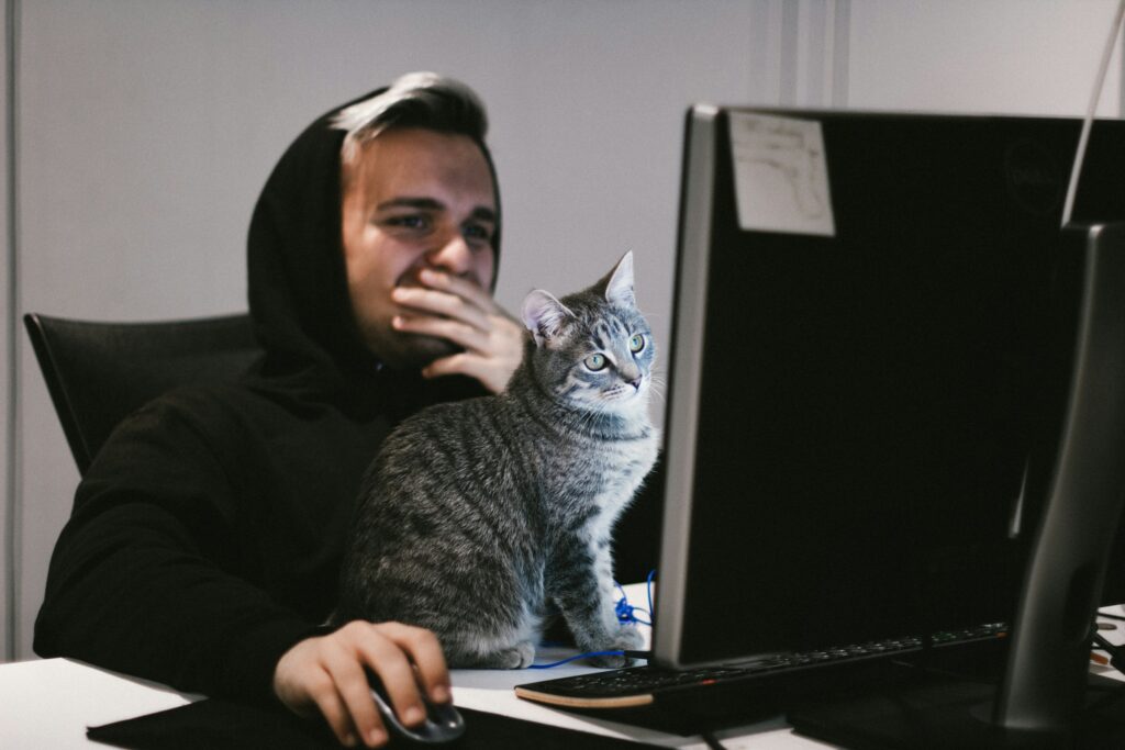 man with a cat - Futures Swing Trading Prop Firm		
