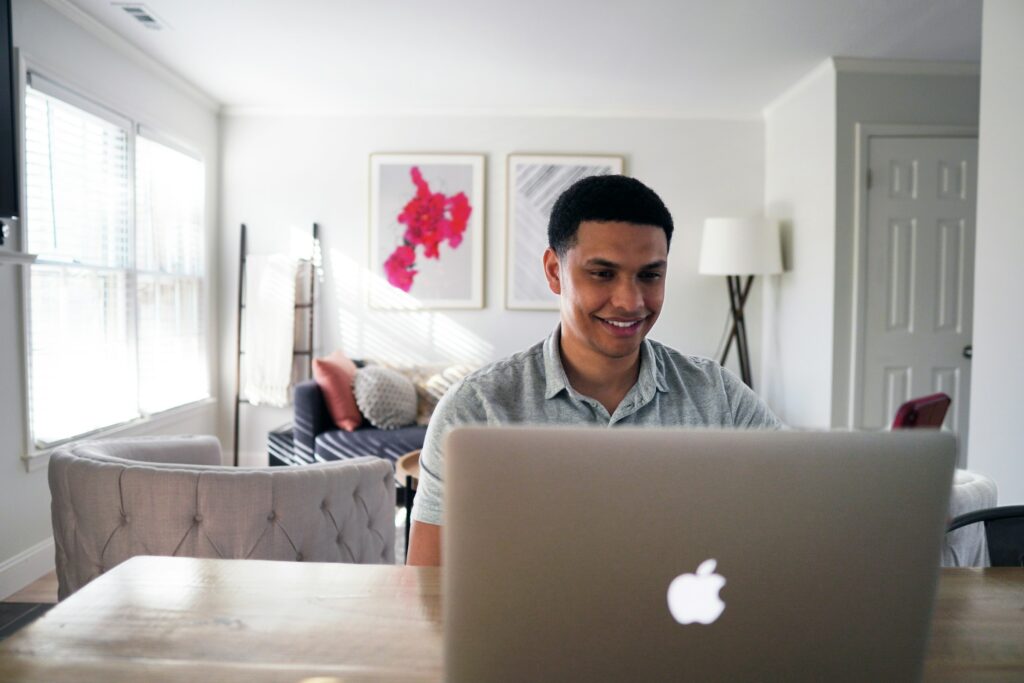 man smiling - Equity Prop Trading Firms	