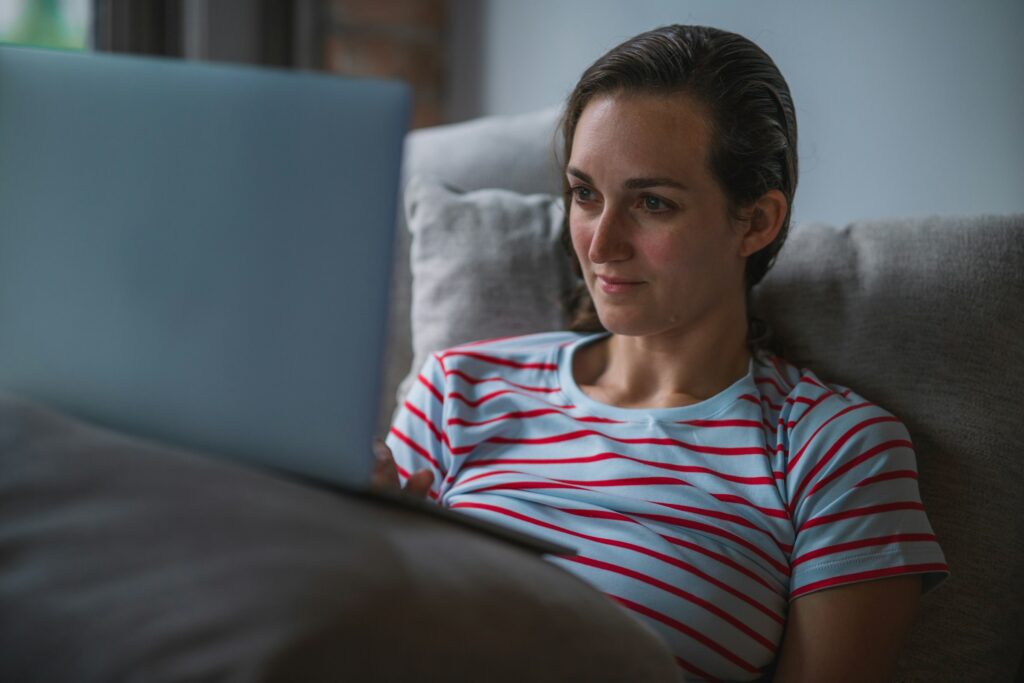 woman on a laptop - Futures Prop Trading Firms