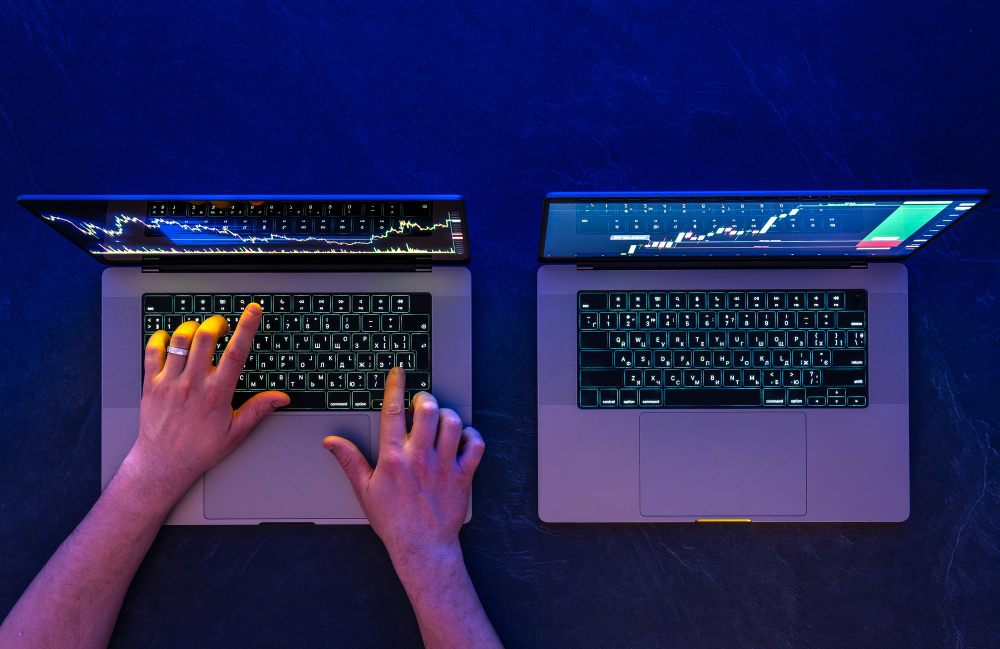 trading on two laptops - Is Copy Trading Profitable