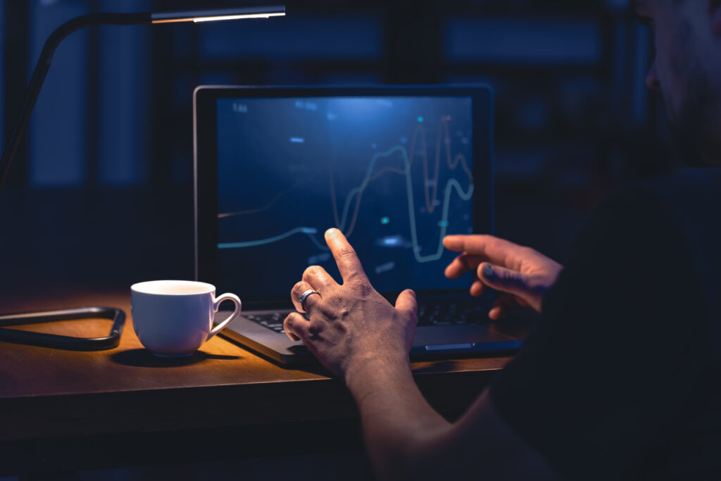 man looking at a trading chart - Short Term Options Trading