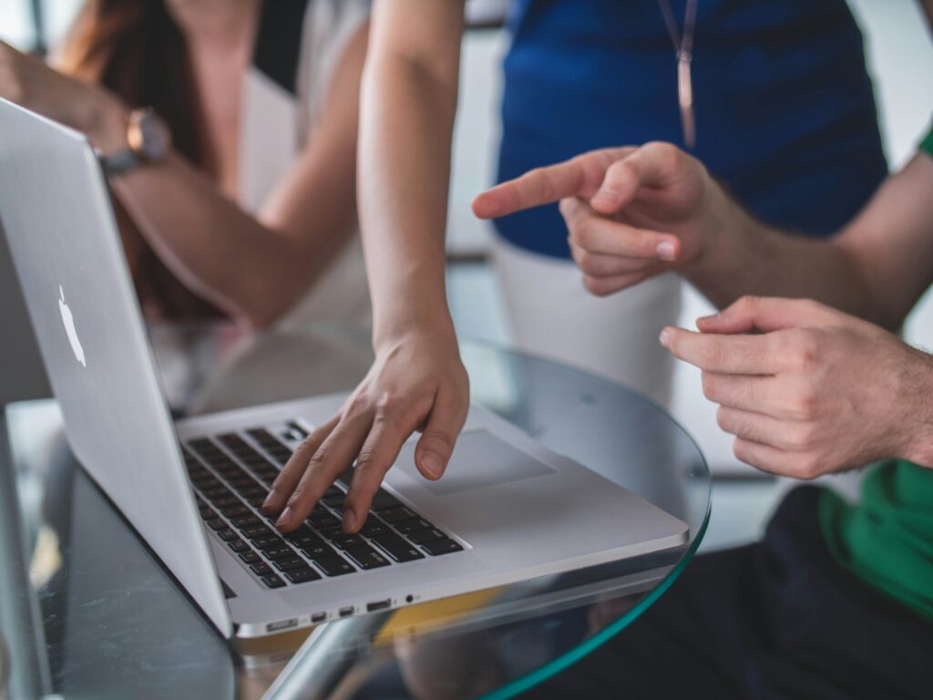 man pointing at a laptop -  Part Time Trading