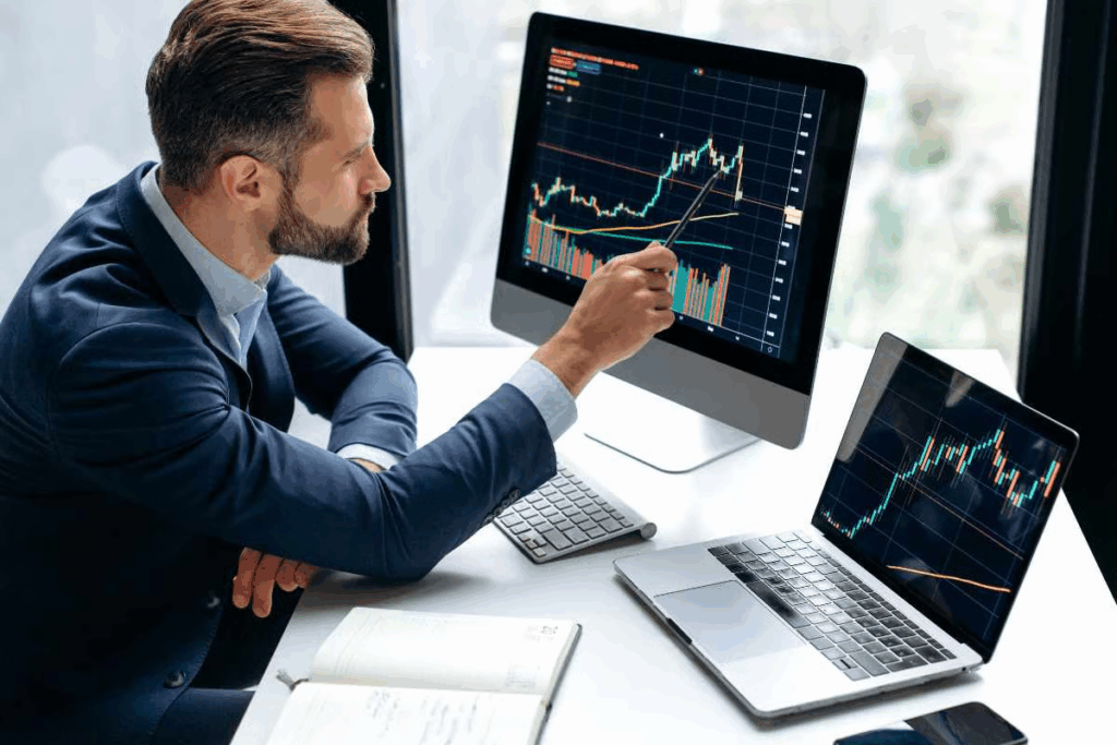 man on a trading chart - Swing Trading Strategies